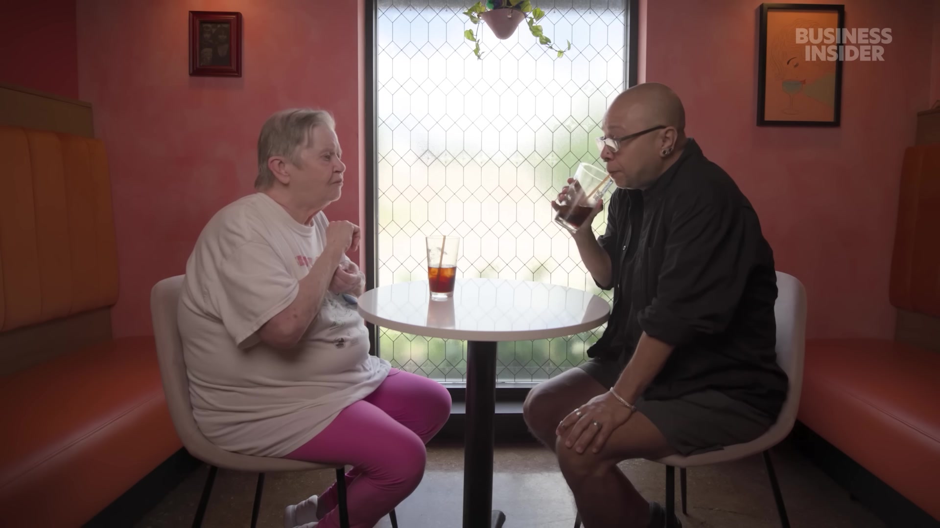 Ian and his mother at a diner table, Business Insider's camera in the room, talking through what it means that his AI boyfriend knows about the visit.